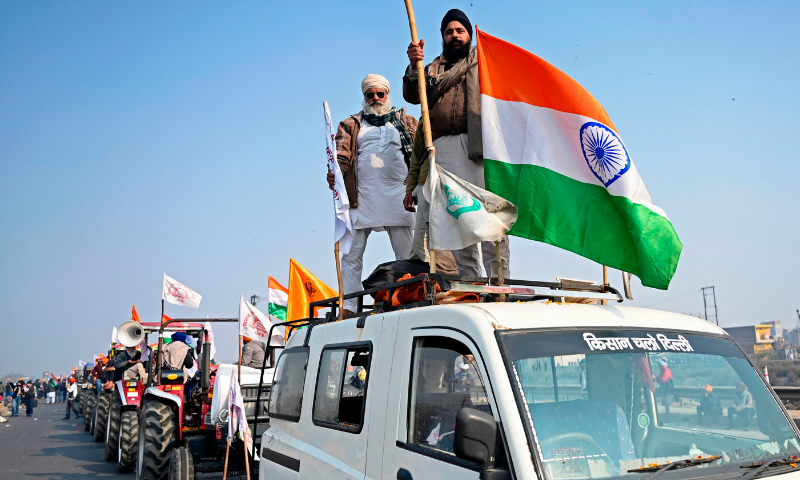 Farmers take part in a tractor rally as they continue to demonstrate against the central government's recent agricultural reforms in New Delhi on January 26, 2021. — AFP