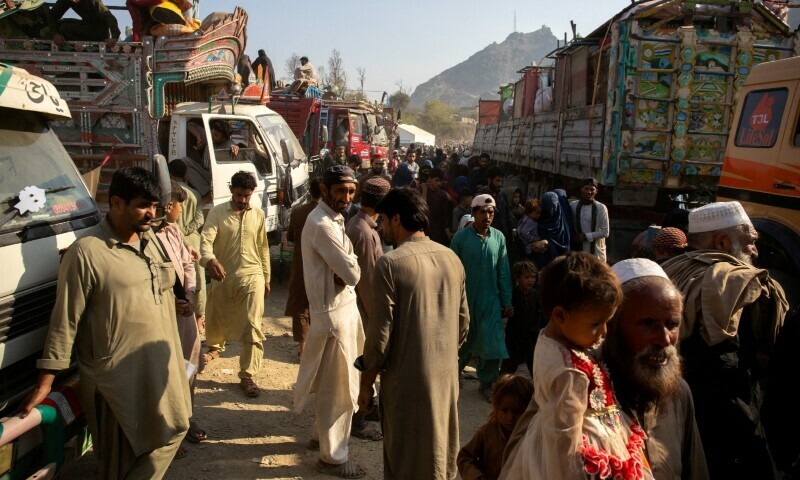 Afghan nationals are pictured as they head back to Afghanistan, at the Torkham border crossing between Pakistan and Afghanistan, October 30. — Reuters