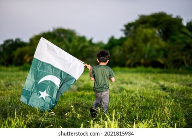 little-boy-holding-pakistan-flag-260nw-2021815934.jpg