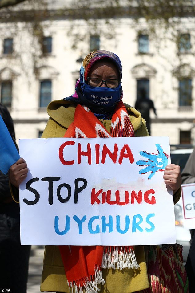 A Uyghur woman during a demonstration in Parliament Square, London, ahead of a House of Commons debate, bought by backbench MP Nus Ghani, on whether Uyghurs in China's Xinjiang province are suffering crimes against humanity