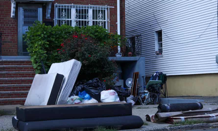 Mattresses and carpets next to the building where two adults and a two-year-old died during flash flooding in New York.