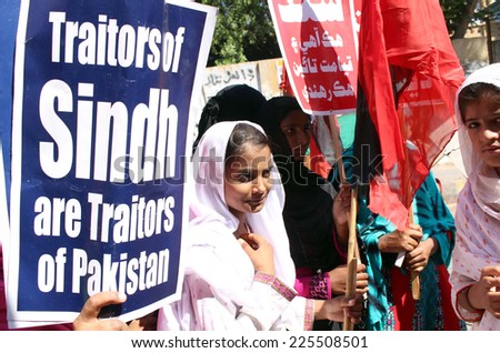 stock-photo-karachi-pakistan-oct-qaumi-awami-tehreek-activists-are-chanting-slogans-against-mqm-225508501.jpg