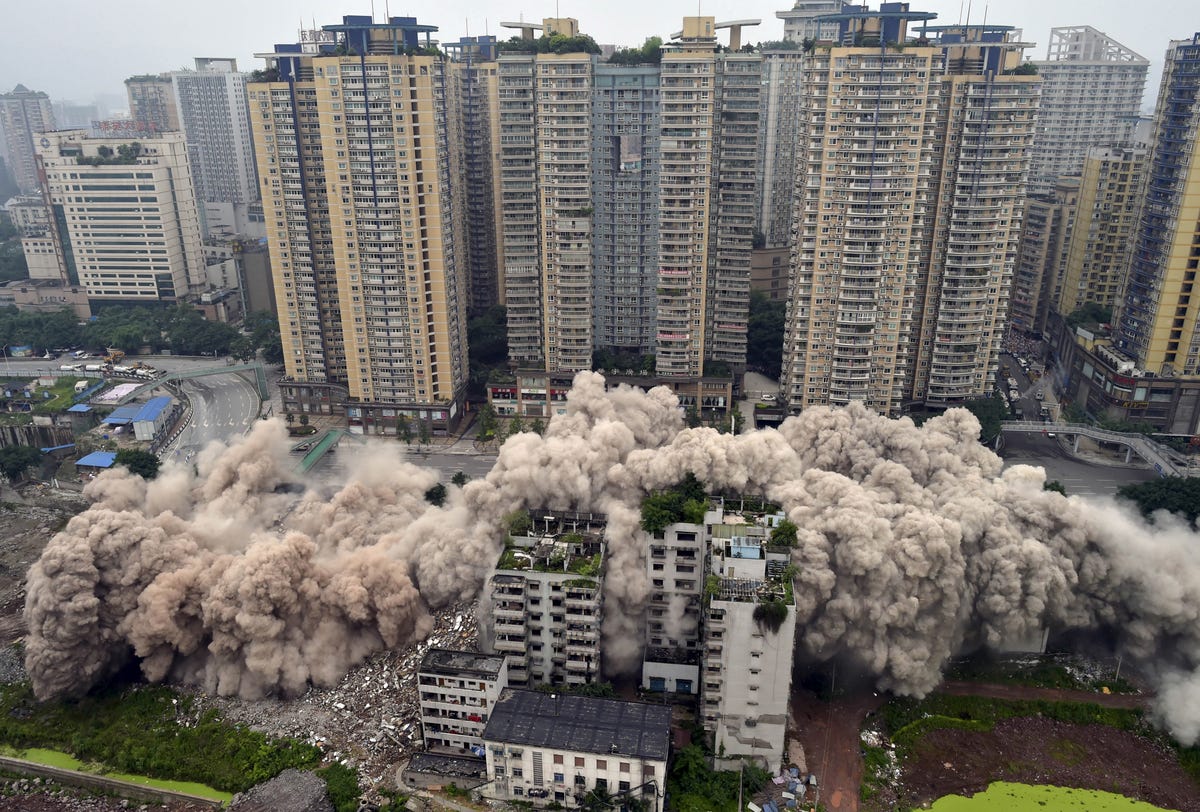 planned-demolitions-have-become-the-norm-in-china-to-make-room-for-the-hundreds-of-millions-of-people-that-will-relocate-to-the-megacities-chinas-government-makes-sacrifices-here-a-residential-high-rise-is-razed-to-make-room-for-a-traffic-hub.jpg