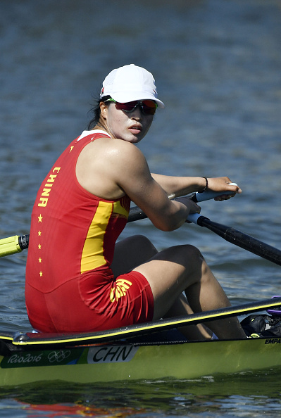 chinas-duan-jingli-looks-on-during-the-womens-single-sculls-rowing-picture-id586407042