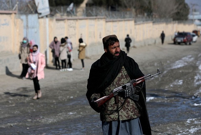 a taliban fighter guards a street in kabul afghanistan december 16 2021 photo reuters