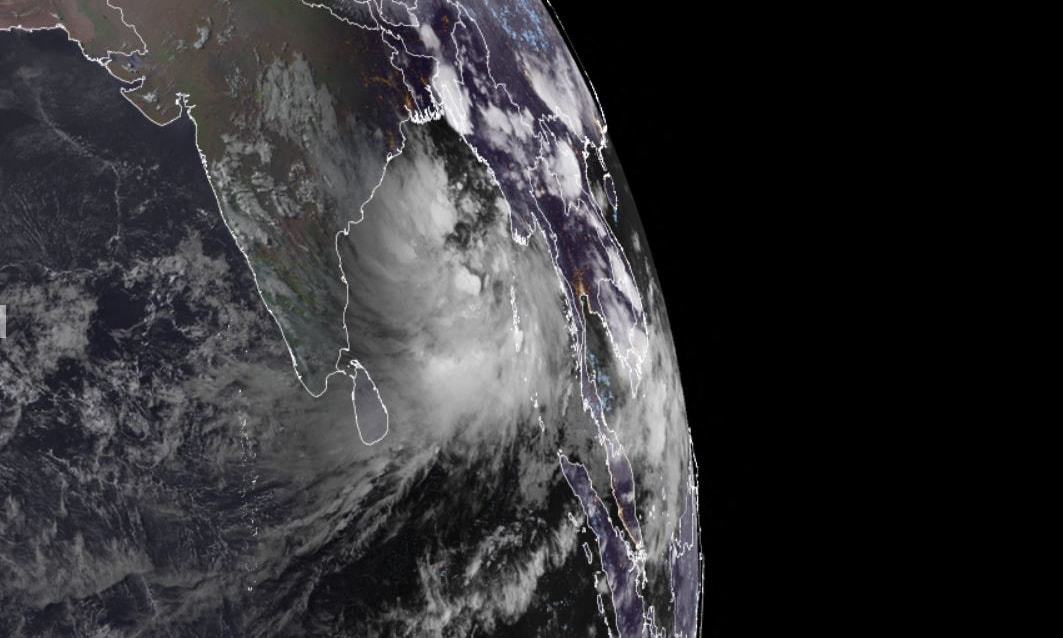 This RAMMB/CIRA handout satellite image shows a cyclone(R) approaching eastern India on May 23, 2021. — AFP