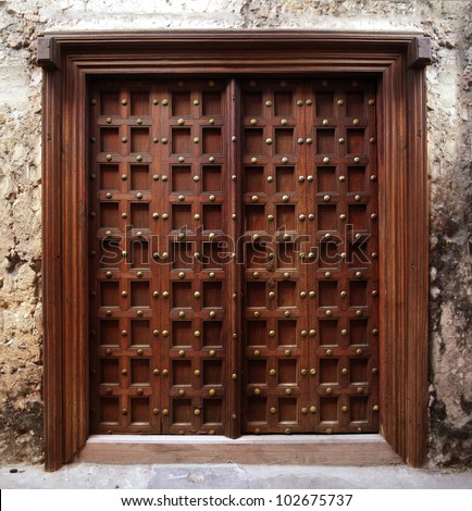 stock-photo-antique-indian-style-wooden-door-102675737.jpg