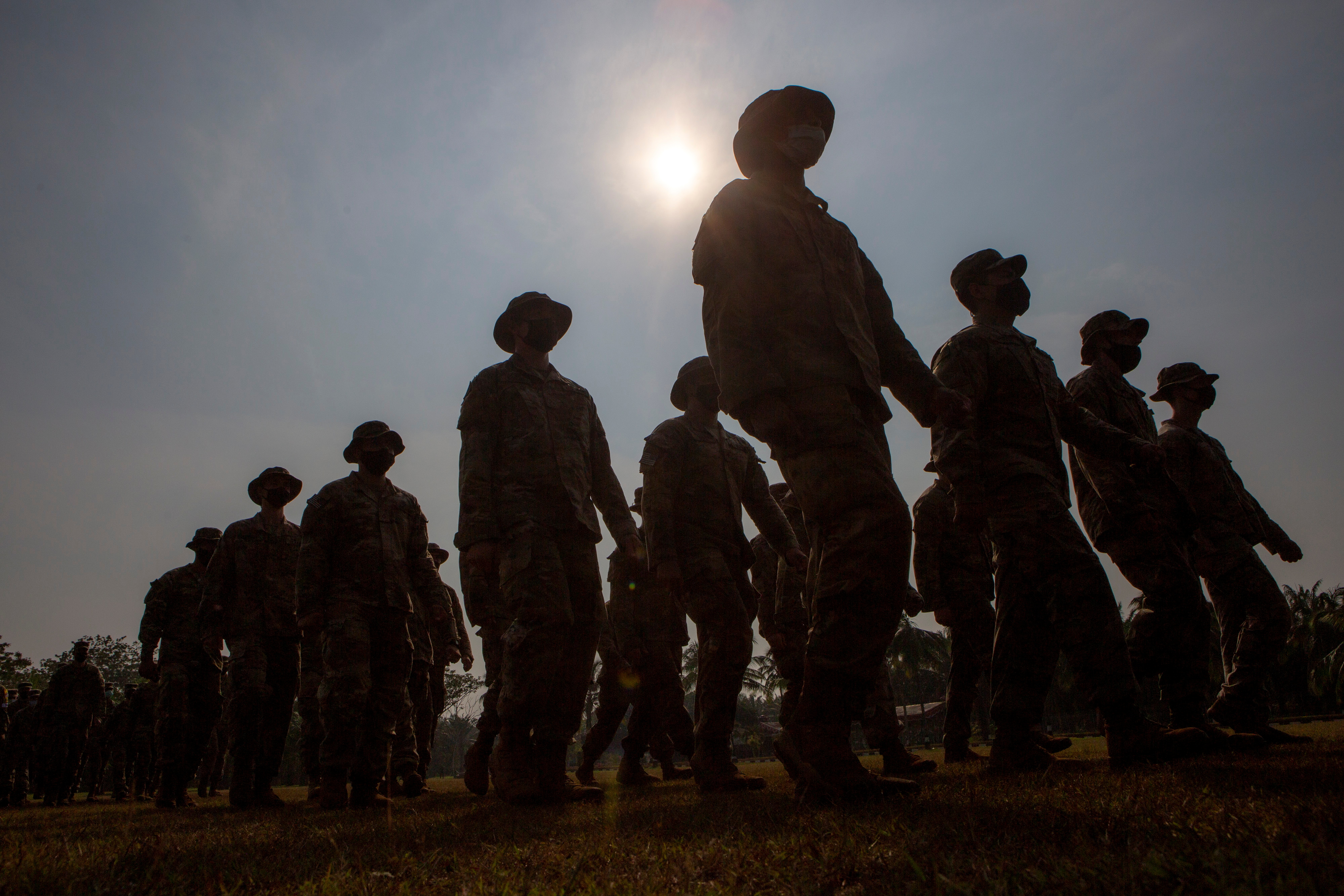 Silhouette of U.S. Army soldiers taking part in the opening of the Garuda Shield Joint Exercise 2021 at the Indonesian Army Combat Training Center in Baturaja, South Sumatra province, Indonesia August 4, 2021. Antara Foto/Nova Wahyudi/via Reuters.