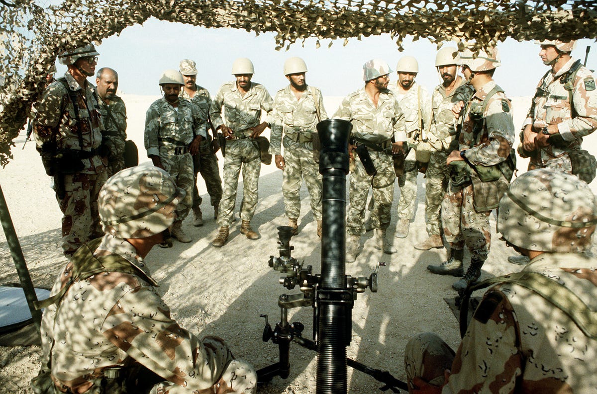 a_member_of_the_1st_battalion,_325th_airborne_infantry_regiment,_explains_the_m252_81mm_mortar_to_saudi_arabian_national_guardsmen.jpeg