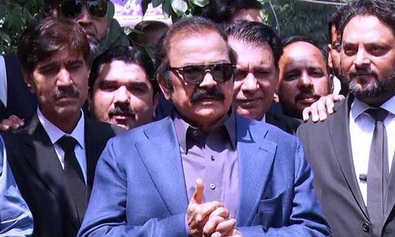 Interior Minister Rana Sanaullah talks to media outside the Lahore district and sessions court on Saturday.—DawnNewsTV