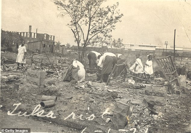 People searching through rubble after the Tulsa Race Massacre in 1921