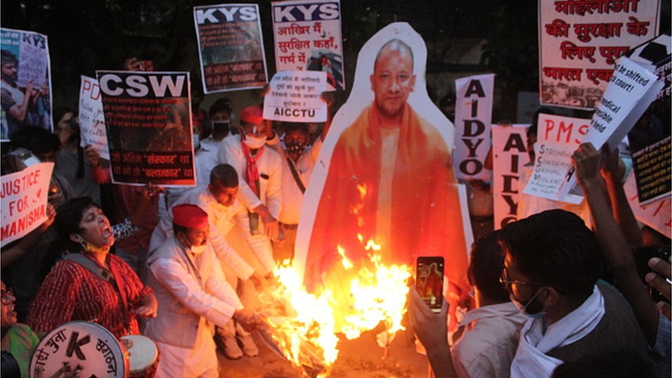 Protesters burn an effigy of Uttar Pradesh Chief Minister Yogi Adityanath