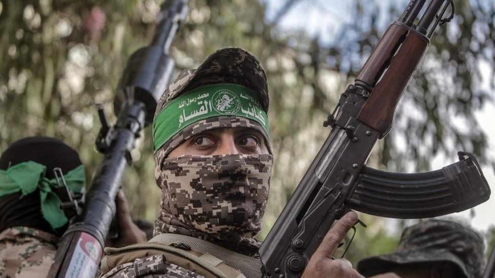 Fighters in Hamas's military wing march in Gaza City on Saturday