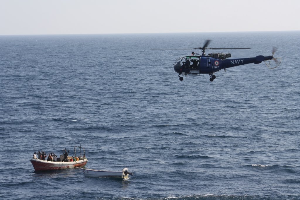 Indian_Naval_helicopter_maintaining_a_close_watch_over_the_pirate_boat.JPG