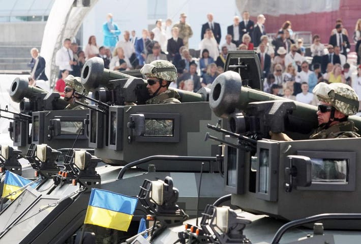 Ukrainian servicemen are seen holding Javelin anti-tank...
