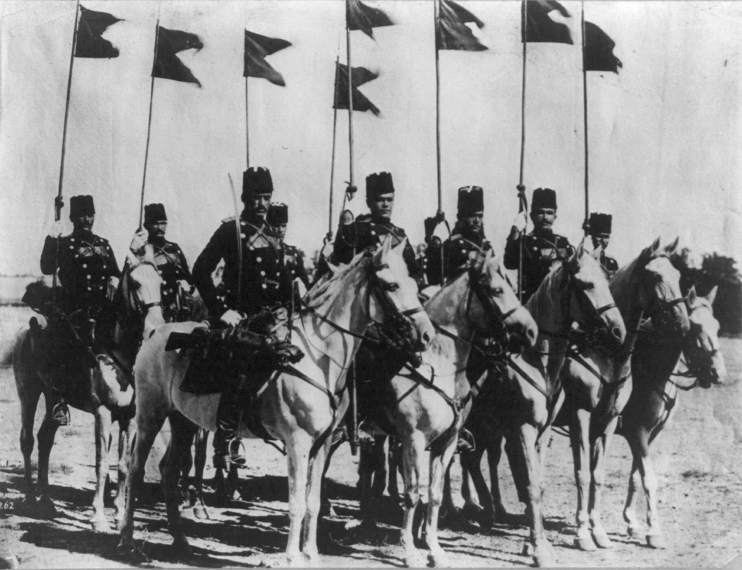 8_members_of_the_Turkish_cavalry_on_horseback_with_flags.jpg