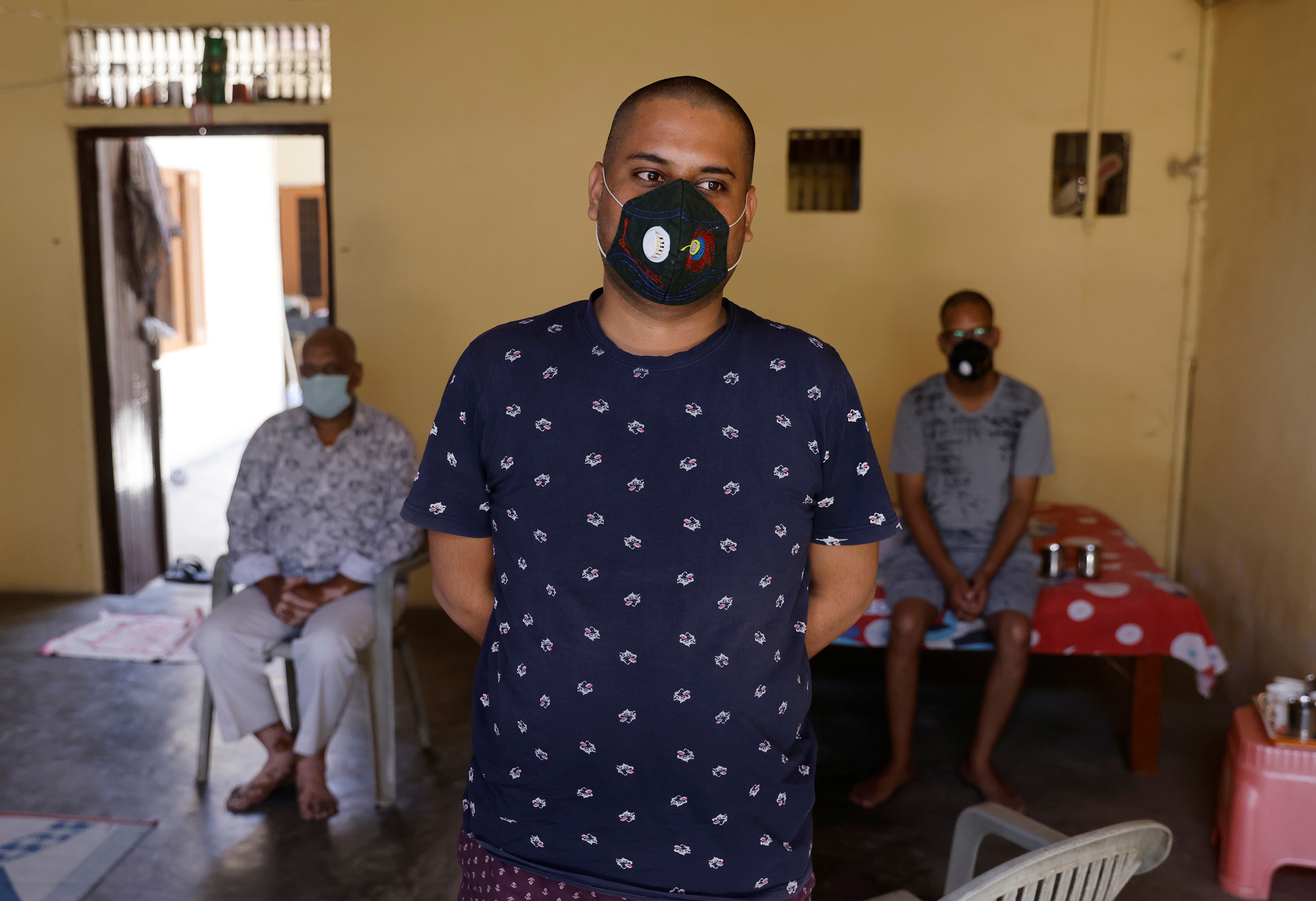 Vaibhav Agarwal, 25, son of Suman Lata, 50, a teacher who died from the coronavirus disease (COVID-19) after she attended her local election duty in April, stands inside his house in the town of Vrindavan in the northern state of Uttar Pradesh, India, May 25, 2021. REUTERS/Adnan Abidi