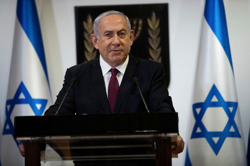 FILE - Israeli Prime Minister Benjamin Netanyahu delivers a statement at the Knesset (Israel Parliament) in Jerusalem, on December 22. 2020.