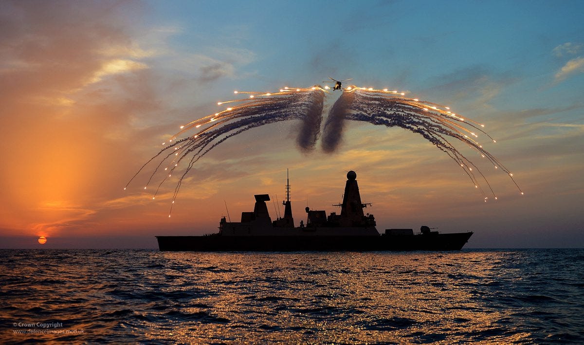 one-of-the-hms-dragons-lynx-helicopters-fires-infrared-flares-during-an-exercise-over-the-destroyer.jpg