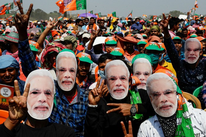 BJP supporters in Modi masks at a March rally addressed by the prime minister in Kolkata. Modi’s party lost the West Bengal state election
