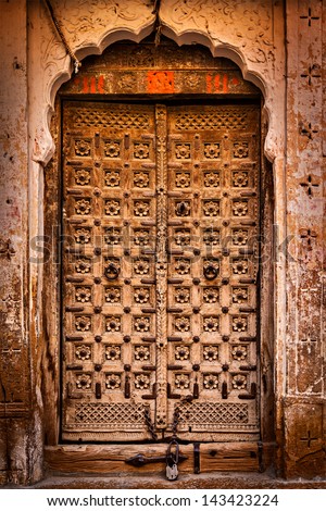 stock-photo-wooden-old-door-vintage-texture-background-143423224.jpg