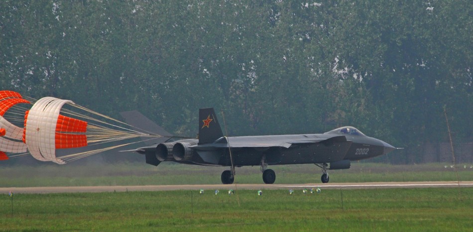 j-20-stealth-fighter-jet-lands-with-a-speed-reduction-parachute-2.jpg