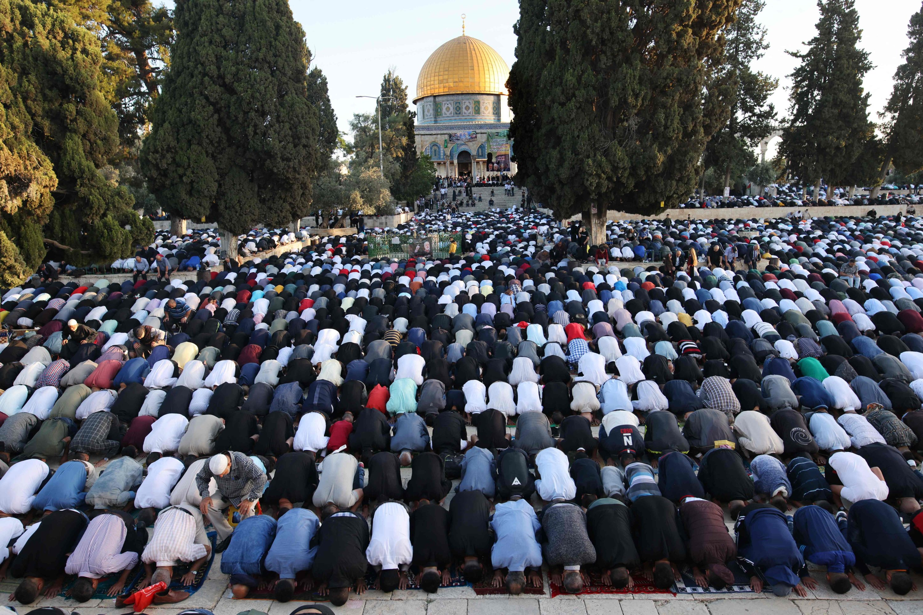 Muslims perform the morning Eid al-Fitr prayer, marking the end of the holy fasting month of Ramadan, outside the Dome of the Rock in the Al-Aqsa Mosque complex, East Jerusalem, occupied Palestine, May 13, 2021. (AFP Photo)