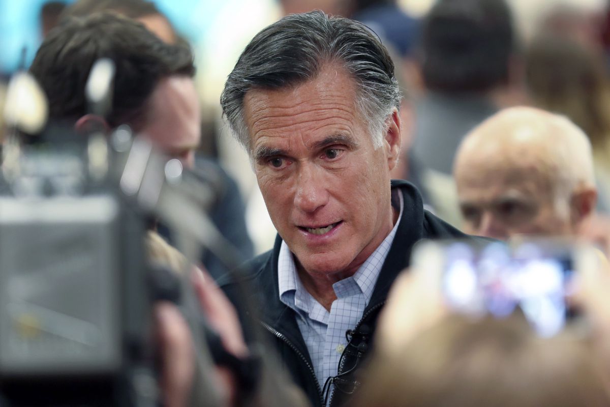 U.S. Sen. Mitt Romney, R-Utah, speaks with audience members following a town hall meeting in Farmington in 2019.