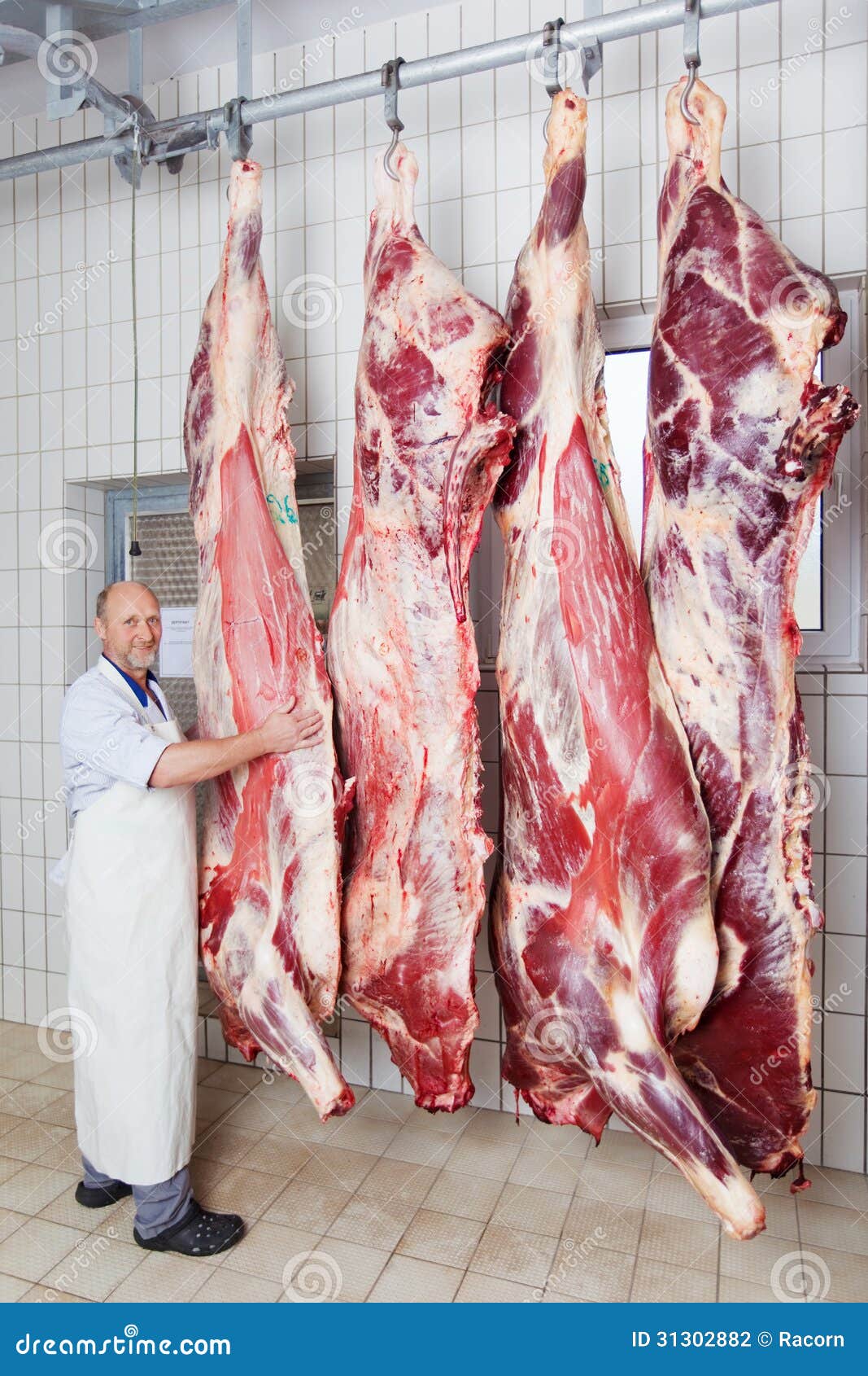 butcher-posing-peeled-bodies-cow-his-shop-31302882.jpg