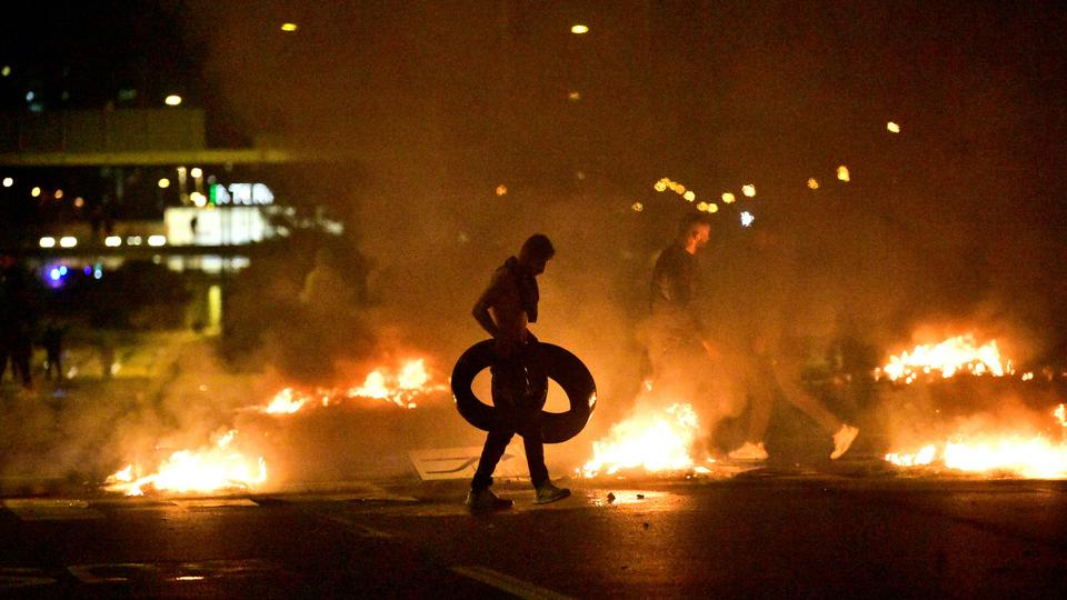Demonstrators burn tyres during a riot in the Rosengard neighbourhood of Malmo, Sweden on August 28, 2020.