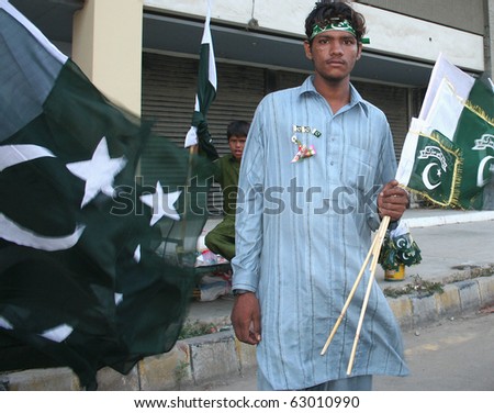 stock-photo-karachi-pakistan-august-two-unidentified-boys-sell-pakistani-flags-on-august-at-a-63010990.jpg