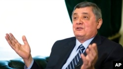 FILE - Russian presidential envoy to Afghanistan Zamir Kabulov speaks during an interview with The Associated Press in Moscow, Feb. 13, 2019.