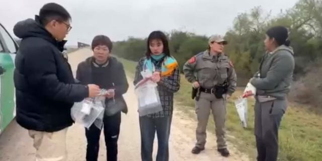 Texas DPS says an interpreter was required to communication with the Chinese nationals. 
