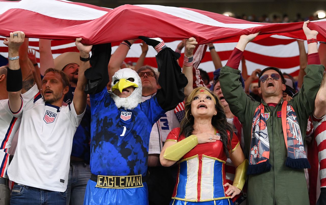 US fans stand for the national anthem prior to the Wales match.