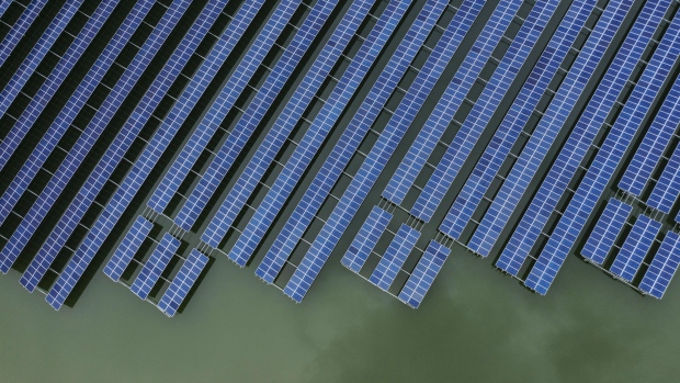photovoltaic-panels-stand-in-a-floating-solar-farm-in-this-aerial-photograph-taken-on-the-outskirts-of-ningbo-zhejiang-province-china-on-wednesday-april-22-2020-china-s-top-leaders-softened-their-tone-on-the-importance-of-reaching-specific-growth-targets-this-year-during-the-latest-politburo-meeting-on-april-17-saying-the-nation-is-facing-unprecedented-economic-difficulty-and-signaling-that-more-stimulus-was-in-the-works-photographer-qilai-shen-bloomberg.jpg