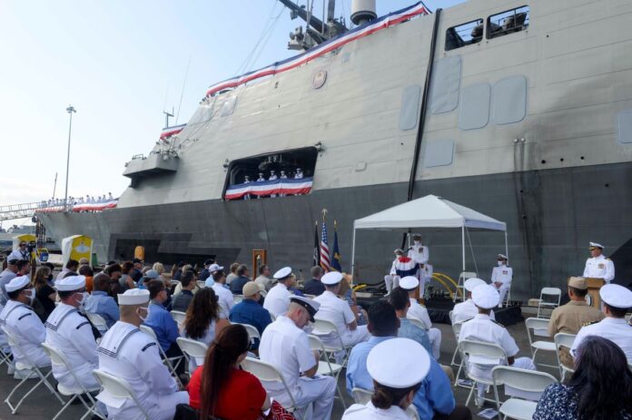 Capt. Larry Repass, commanding officer of Freedom-variant littoral combat ship USS Freedom (LCS 1) delivers remarks during Freedom’s decommissioning ceremony. Freedom was decommissioned after more than 10 years of service. Commissioned Nov. 8, 2008, Freedom has been a test and training ship and was key in developing the operational concepts foundational to the current configuration and deployment of LCS today.