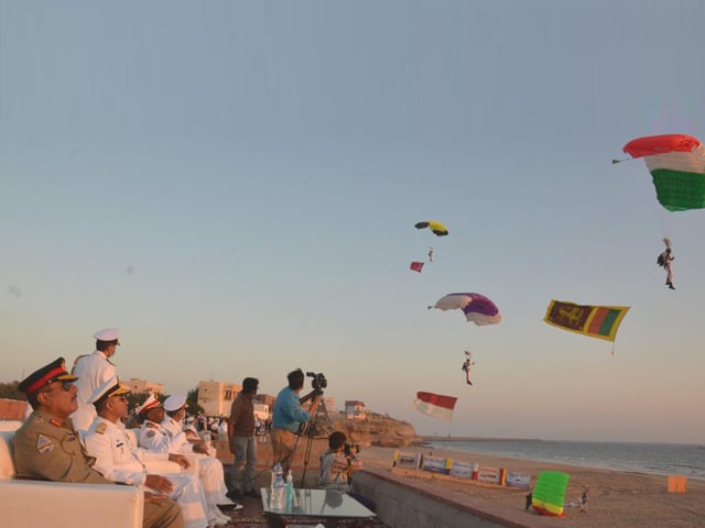 military and naval officers witnessing parachuting on day 3 of aman 2021 exercise in arabian sea photo ispr