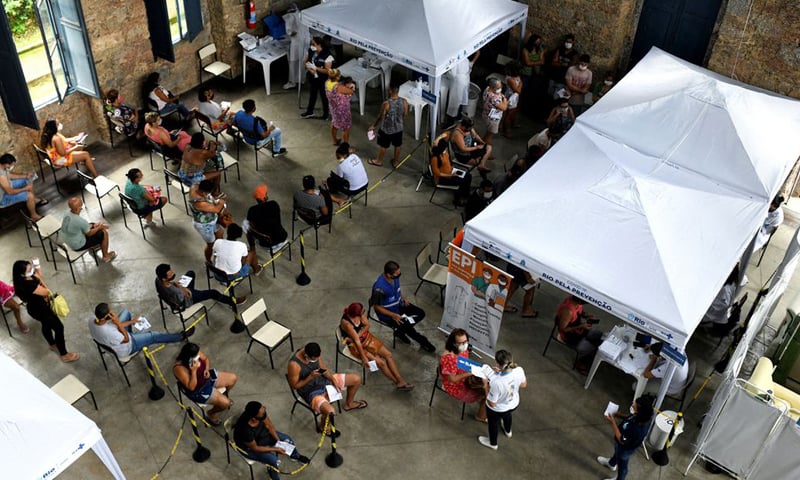 People wait to receive medical attention and to be tested for Covid-19 at Princess Isabel Palace, where a healthcare unit specialising in Covid-19 and flu symptoms has been set up, in Rio de Janeiro, Brazil. — Reuters/File