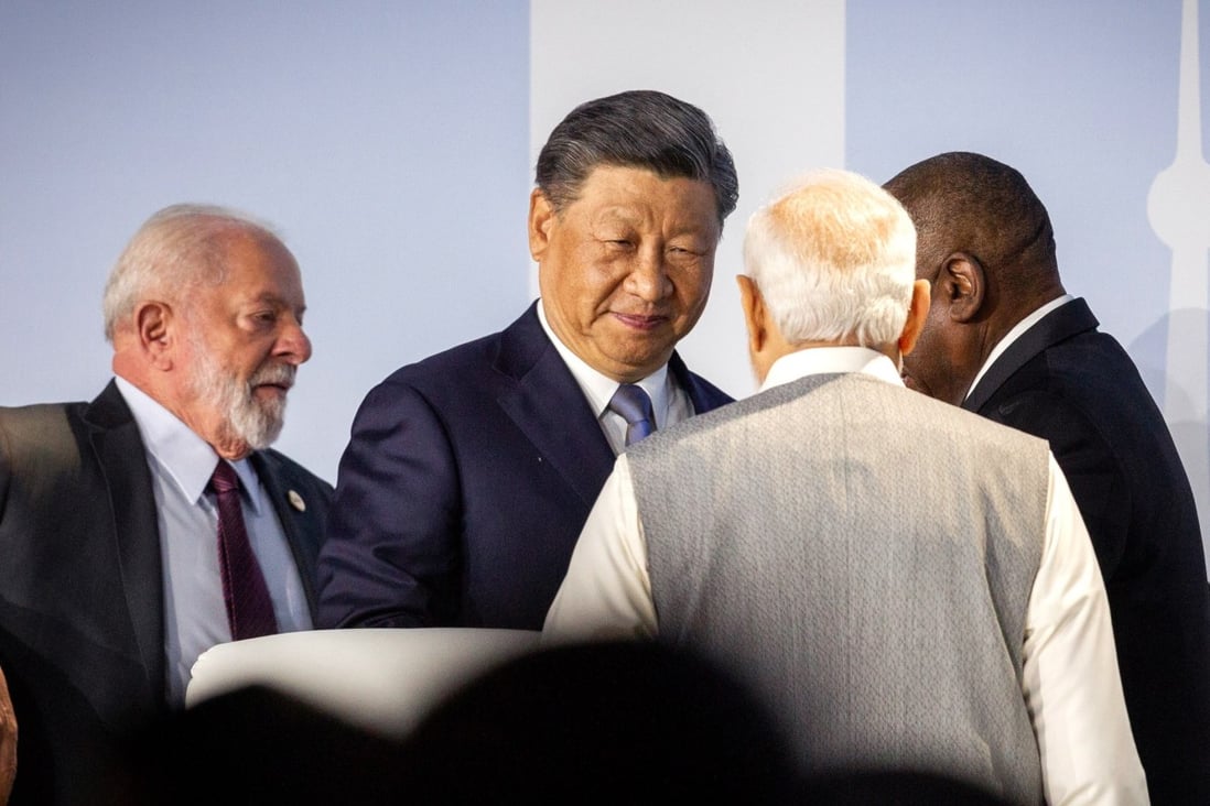 Chinese President Xi Jinping (centre) listening to Indian Prime Minister Narendra Modi at a Brics event on Thursday. Photo: EPA-EFE