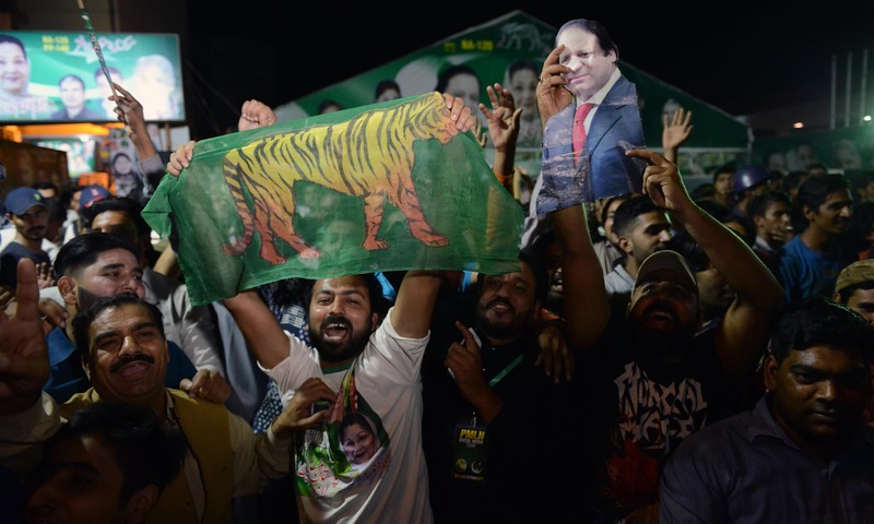 PML-N activists celebrate Kulsoom Nawaz's victory in the by-election in Lahore. —AFP