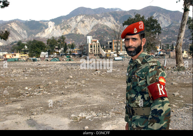 a-pakistani-soldier-stand-nearby-the-ruins-of-a-destroyed-hsopital-d3ncff.jpg