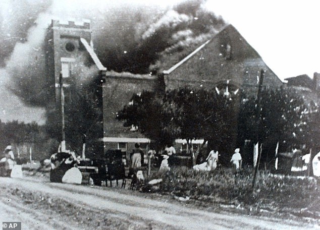 Mt. Zion Baptist Church burns after being torched by white mobs during the 1921 Tulsa massacre. The number that died in the massacre has never been confirmed