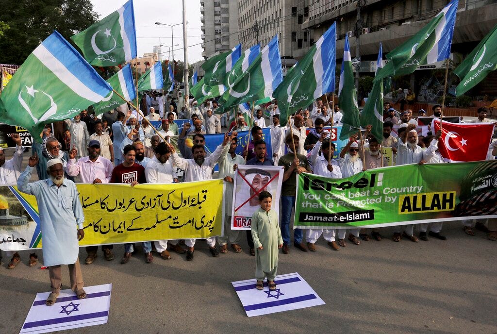 Supporters of the Islamist party Jamaat-e-Islami rally in Karachi, Pakistan against the United Arab Emirates-Israeli deal to establish full diplomatic ties