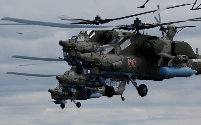 Russian Mi-28N military helicopters fly during a rehearsal for the Victory Day air parade, which marks the 75th anniversary of the victory over Nazi Germany in World War Two, in Saint Petersburg, Russia May 7, 2020.