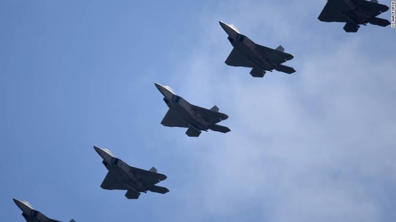 US Air Force F-22 Raptors fly in formation over Altus Air Force Base in Oklahoma on April 17, 2017.