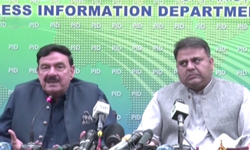 Interior Minister Sheikh Rashid Ahmed (left) and Minister for Information and Broadcasting Fawad Chaudhry address a press conference in Islamabad. — DawnNewsTV