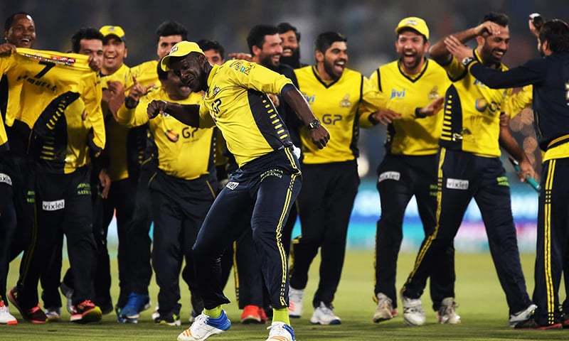 Peshawar Zalmi captain Daren Sammy (C) celebrates with teammates his team's victory over Quetta Gladiators in the final cricket match of the Pakistan Super League (PSL) at The Gaddafi Cricket Stadium in Lahore on March 5, 2017. — AFP/File