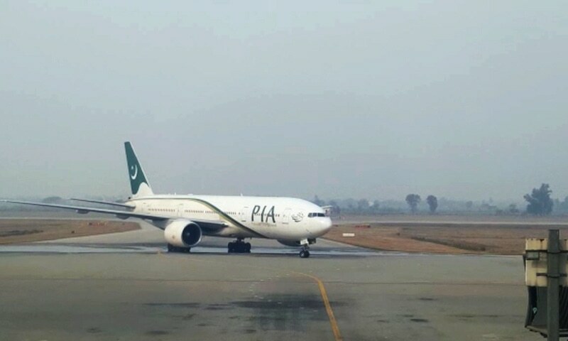 Pakistan International Airlines aircraft on the runway at Sialkot International Airport. — Photo by Abid Hussain Mehdi/File