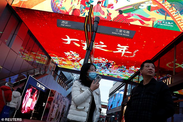 With the Winter Olympics beginning next week, Chinese authorities have scrambled to eradicate flare-ups in several major cities, including Beijing (pictured on Friday)