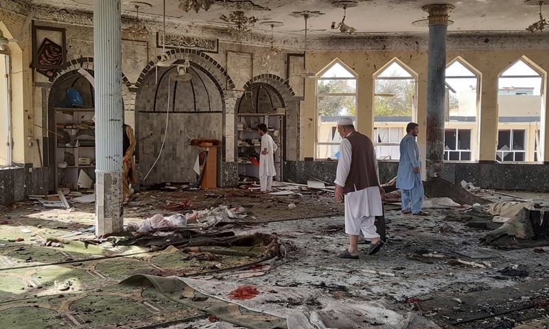 People inspect the inside of a mosque in Kunduz, Afghanistan, following an explosion. — AP